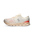 Cream and coral red On Cloud X 4 sneaker side view on white background
