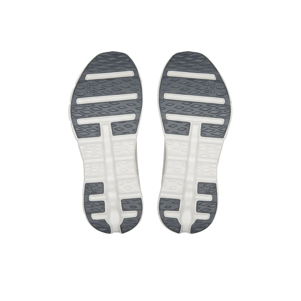 On white and dark grey outsoles, bottom view on white
