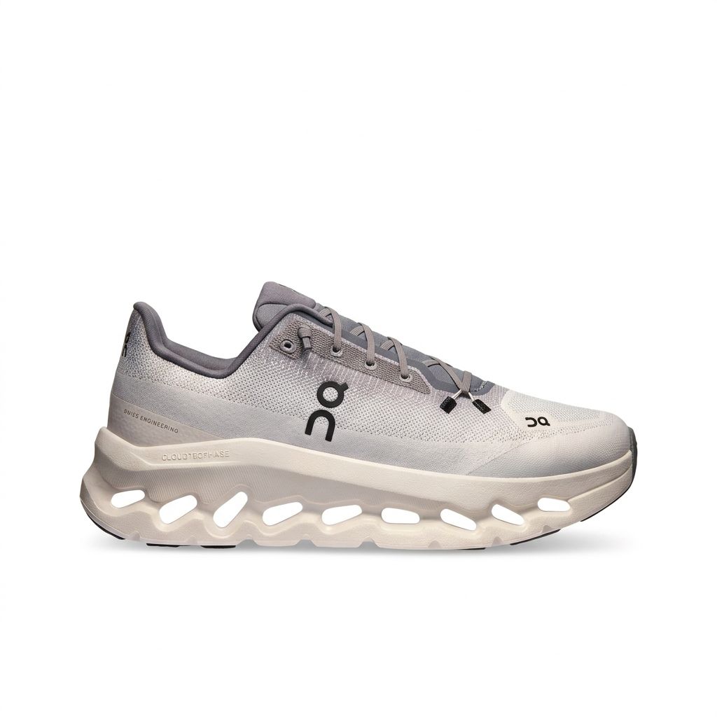 On Cloudtilt light grey and ivory sneakers, right-facing side view on a white background